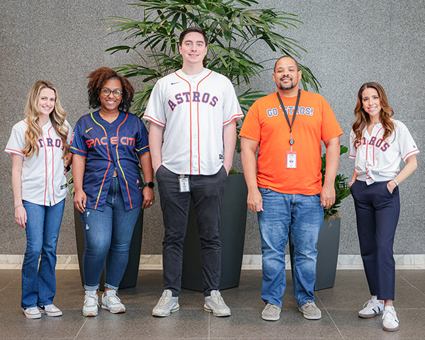 Group of employees posing for a photo